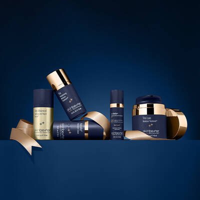 Skinbetter science product and bag on a dark blue background